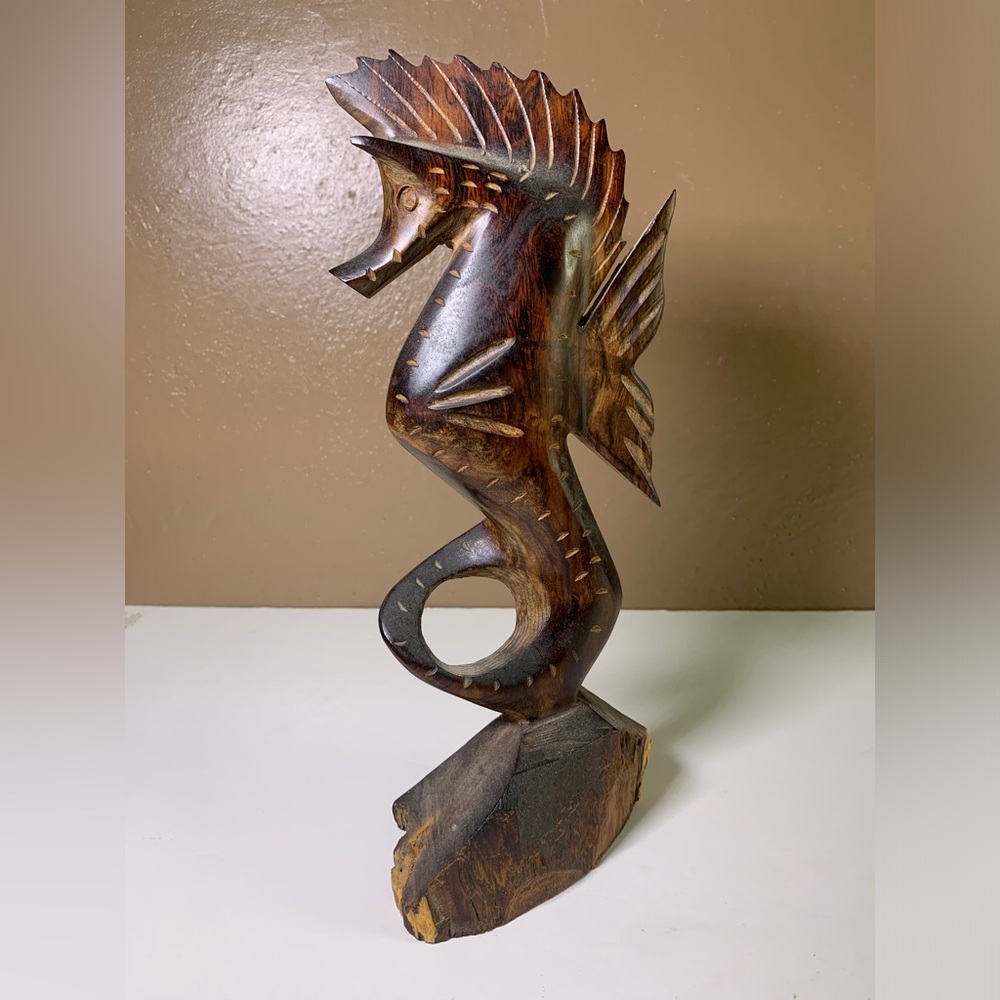 Hand carved sea horse statue